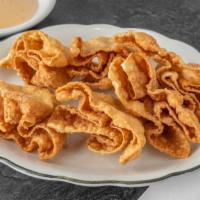 Crab Rangoon (6) · Crispy wonton pastry stuffed with cream cheese and imitation crab meat, served with sweet an...