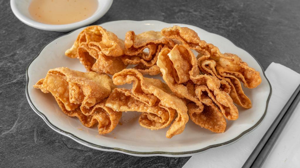 Crab Rangoon (6) · Crispy wonton pastry stuffed with cream cheese and imitation crab meat, served with sweet and sour sauce.