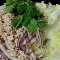 Nam Sode (Chicken Salad) · A traditional Thai chicken salad that combines ground chicken (white meat) with special lemo...