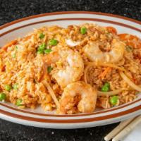 Fried Rice · White rice stir-fried with carrots, onions, green peas, eggs and your choice of meat with ta...