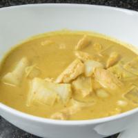 Yellow Curry (Curry Kai) · Tender slices of chicken simmered in coconut milk, a mild yellow curry paste, potatoes and o...