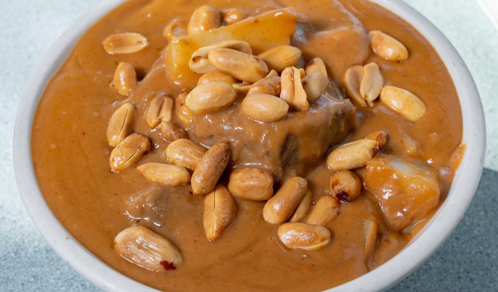 Massaman Curry · A native Thai recipe. This chef specialty curry cook with coco nut milk and various herbs and spices, with potatoes and roasted peanuts.