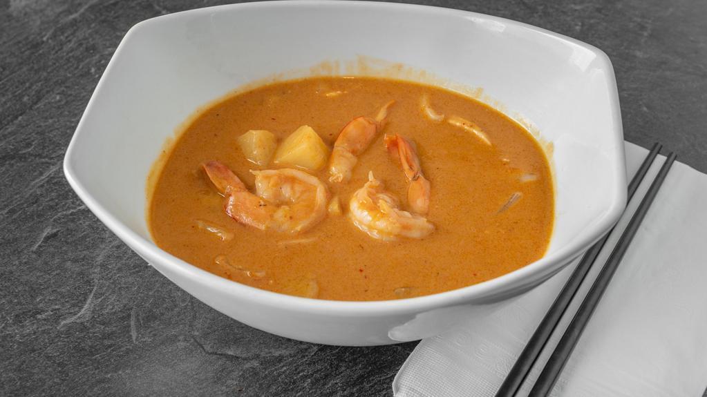 Shrimp Curry With Pineapple · Very special shrimp curry dish. Fresh shrimp cooked with chunks of pineapples and coconut milk in a mild tasty chili paste. Served with jasmine rice.
