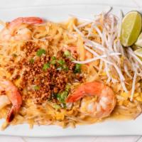 Pad Thai · Rice noodles sautéed with egg and bean sprouts topped with crushed peanuts, scallions and be...
