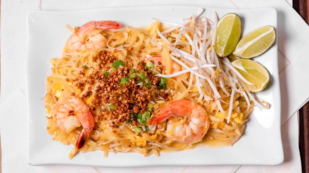 Pad Thai · Rice noodles sautéed with egg and bean sprouts topped with crushed peanuts, scallions and bean sprouts.