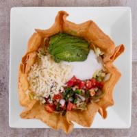 Taco Salad · Your choice of ground beef, shredded beef or shredded chicken in a crisp flour tortilla, let...
