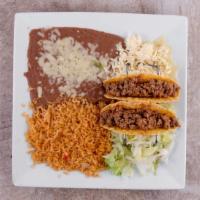 Two Tacos, Mexican Rice And Refried Beans · 