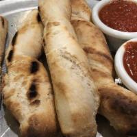 Bread Sticks (4) · Homemade and hand rolled, grilled and served with Byrne’s Red Sauce