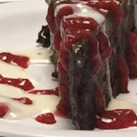 Flourless Bete Noir Chocolate Cake · With vanilla and raspberry sauce (a must with red wine).