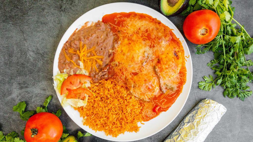 Huevos Rancheros / Rancheros Eggs · 3 egg topped home made sauce melted cheese  with rice and beans and your choice off tortillas flour or corn.