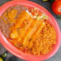 Enchiladas · three corn tortillas filed with your choice of meat topped with tomatoes base sauce melted c...