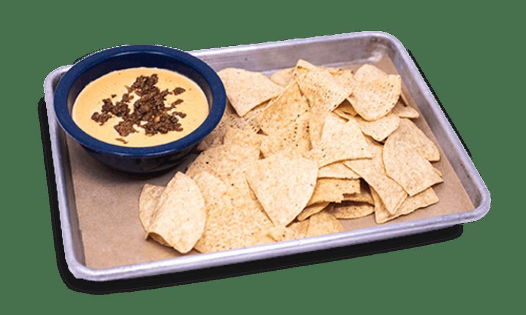 Cowboy Queso Appetizer · Our signature queso recipe served with. tortilla chips.