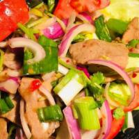 Thai Beef Salad · Gluten free. Grilled slice beef, cilantro, red onion, cucumber, tomatoes, green onion, and i...