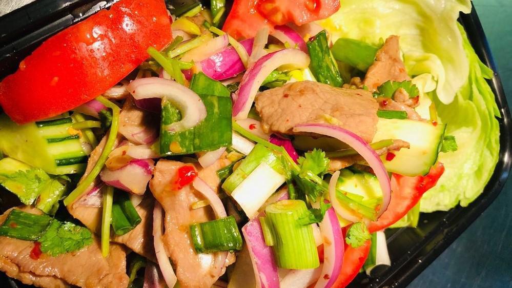 Thai Beef Salad · Gluten free. Grilled slice beef, cilantro, red onion, cucumber, tomatoes, green onion, and in a lime dressing.