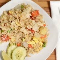 Pineapple Fried Rice · Pea, carrot, pineapple, tomatoes, onion, and egg.