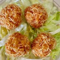 炸 蝦 丸 (四 件) / Deep-Fried Shrimp Balls · Four (4) large crispy shrimp balls on a bed of lettuce.