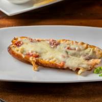 Aborrajado · Sweet plantain filled with guava, topped with melted cheese.