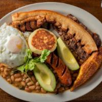Bandeja Paisa · Char-broiled, Colombian-style cut rib-eye steak served with fried pork belly, chorizo, rice,...