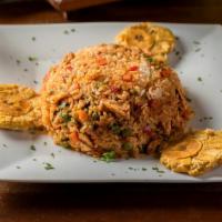 Arroz Con Pollo · Boneless chicken breast with rice, peas and traditional flavors.