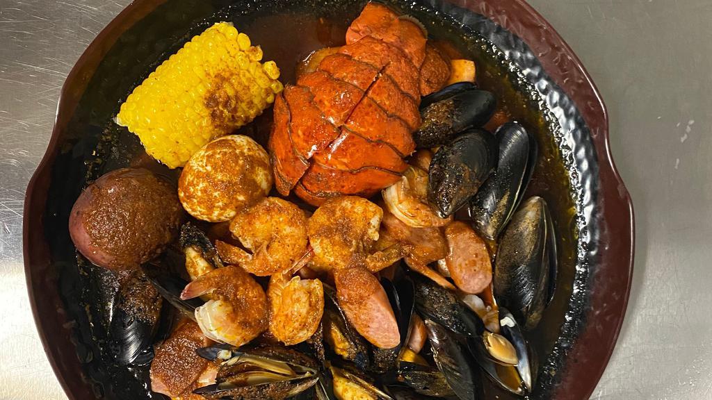 C2 · One  lobster tail, one-half pound  shrimp (no head), one-half pound   black mussel, one-half pound  all-meat sausage, one  boiled egg, one corn, one  potato.