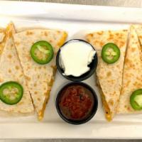 Grilled Chicken Quesadillas · Filled with wood grilled chicken, a blend of cheeses, green and red peppers, scallions and C...