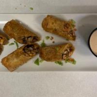Southwest Egg Rolls · Seasoned chicken, chipotle peppers, onions, black beans, fire roasted corn and chihuahua che...