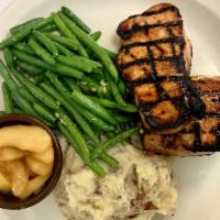 Pork Chops · Two boneless center cut pork chops wood-grilled. Served with homemade yukon gold mashed pota...