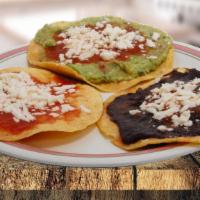 Tostadas · Sauce or beans or guacamole or meat. / Salsa or frijol or guacamole or carne.
