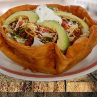 Taco Salad · With lettuce, choice your meat, tomatoes, avocado, yellow cheese, white cheese and sour crea...