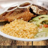 Fried Mojarra / Mojarra Frita · Fried fish, accompanied by rice and house salad.
Pescado Frito, acompañado de arroz y ensala...