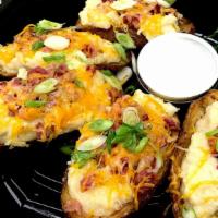 Loaded Potato Skins · Gluten-Free. Crispy potato carved & filled with a creamy garlic mashed potatoes. Top with la...