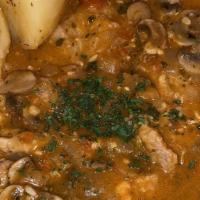 Veal Amici · Fresh veal medallions sautéed with mushrooms, onions and served in a special white tomato wi...