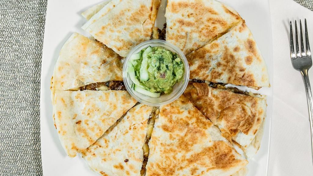Quesadilla · On large flour tortilla with melted cheese.