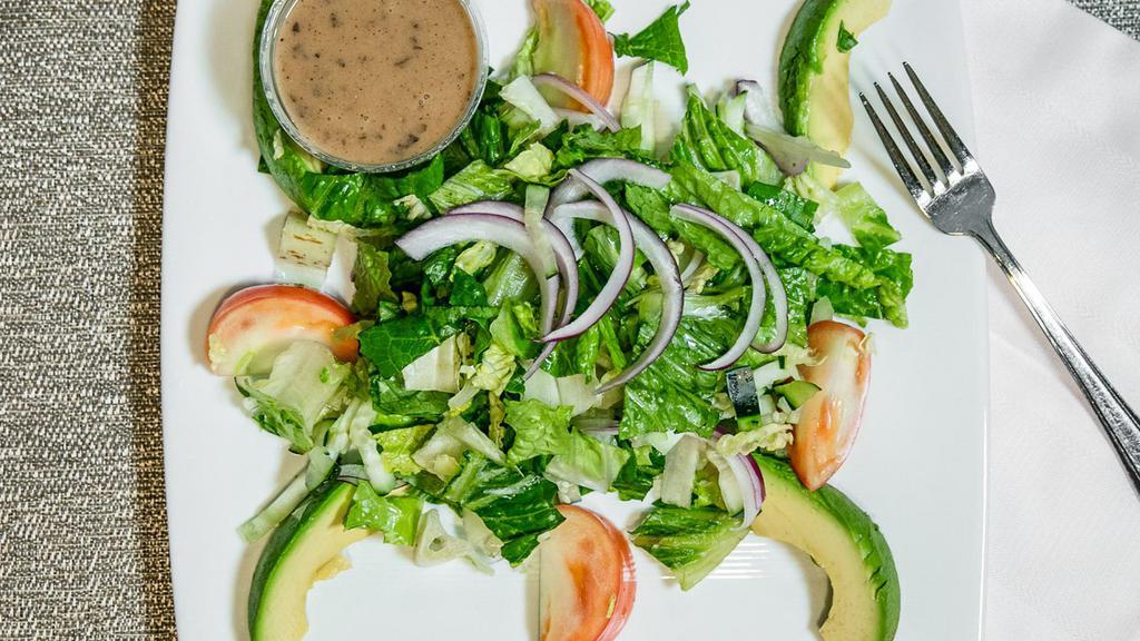 Garden Salad · Grilled chicken breast, lettuce, tomatoes, onion with sliced avocado.