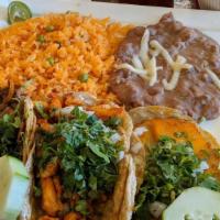 3 Tacos Dinner · Popular item. Choice of meat. Served with Mexican rice and beans. Topped with onion and cila...