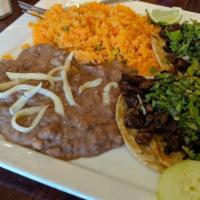 2 Tacos Dinner · Popular item. Your choice of meat. Served with Mexican rice and beans. Topped with onion and...