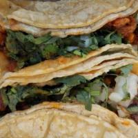 Al Pastor Taco · Popular item. Marinated pork and pineapple. Topped with onion and cilantro.