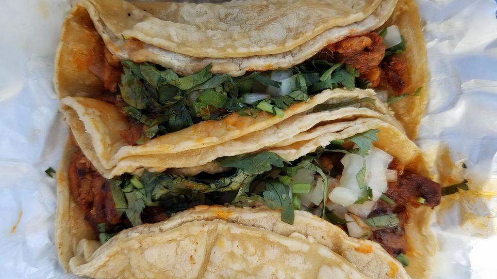 Al Pastor Taco · Popular item. Marinated pork and pineapple. Topped with onion and cilantro.