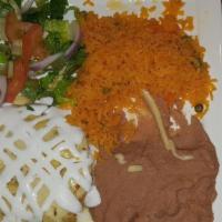 Enchiladas Dinner · Three corn tortillas filled with chicken tinga and topped with salsa, melted chihuahua chees...