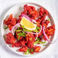 Chicken 65 · Fried chicken tossed with green chilies, curry leaves and spices.