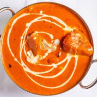 Butter Chicken · Chicken cooked with butter and creamy curry sauce.