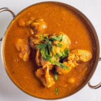 Chicken Curry · Boneless chicken cooked with delicate curry sauce.