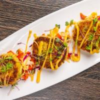 Crab Cakes · Served with classic mustard sauce, fried and Asian slaw.