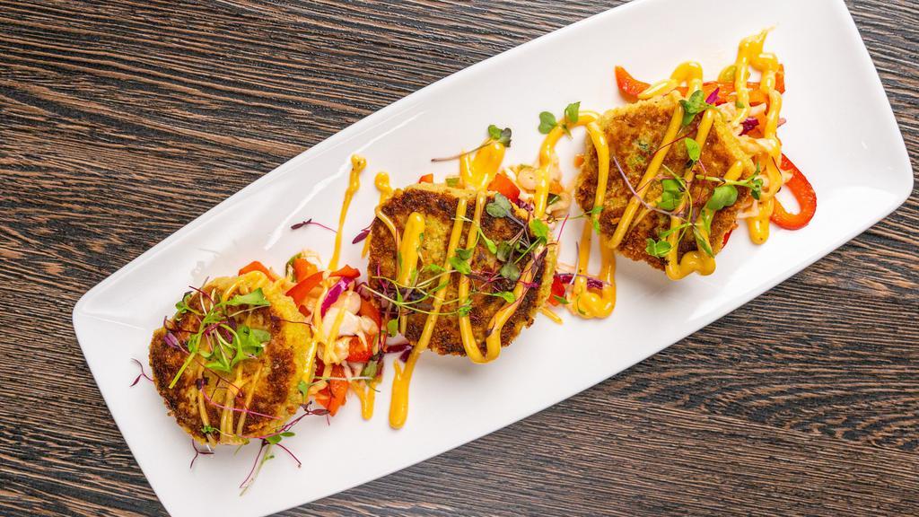 Crab Cakes · Served with classic mustard sauce and Asian slaw.