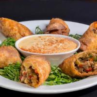 Philly Cheese Steak Egg Rolls · Shaved sirloin, provolone, and mozzarella cheese blend, peppers and onions, pepper jack ques...