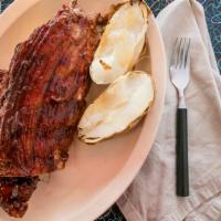 Bbq Baby Back Ribs · Slow cooked, fall off the bone served with homemade BBQ sauce, fries or baked potato, colesl...