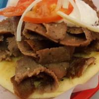 Gyros Sandwich · Delicious gyros cut fresh off the spit and served on a grilled pita with homemade gyro sauce...