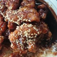 Sesame Chicken · Spicy. Tender chunk of chicken deep fried till crispy with sesame seeds on top of chicken in...