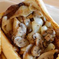 Steak Sandwich · With mushrooms and grilled onions on garlic bread.