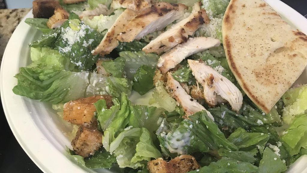 Caesar Salad · Crispy romaine lettuce with Caesar dressing, croutons and Parmesan cheese. Try it with chicken for an additional charge.